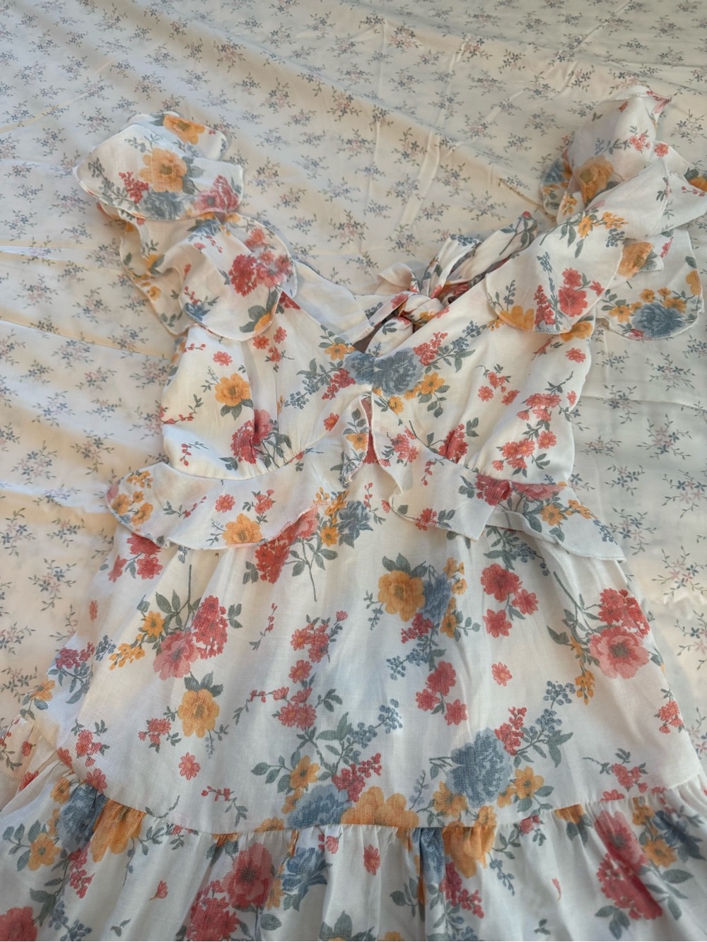 Floral mini dress with flutter sleeves and keyhole back